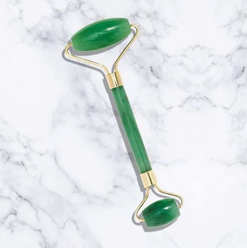 Jade roller massager with rose quartz gua sha stone, dual-sided natural jade facial tool for tension relief and skincare absorption.