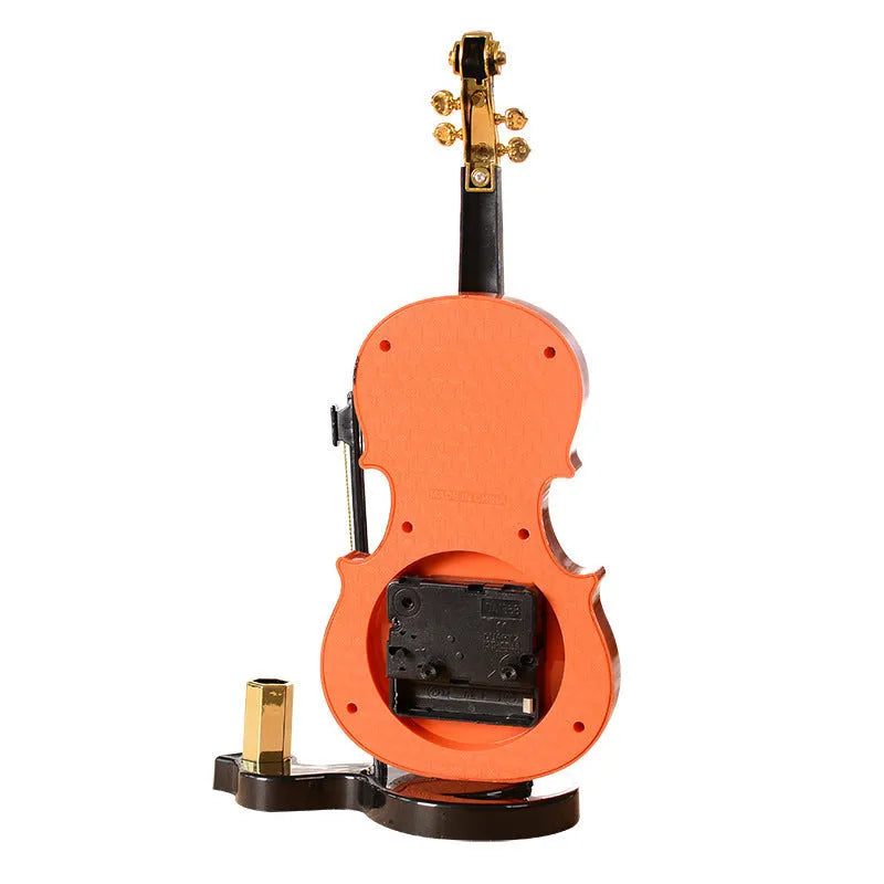 Brown violin pen inserted alarm clock with LED and pointer display, plastic body, 290 x 145 mm