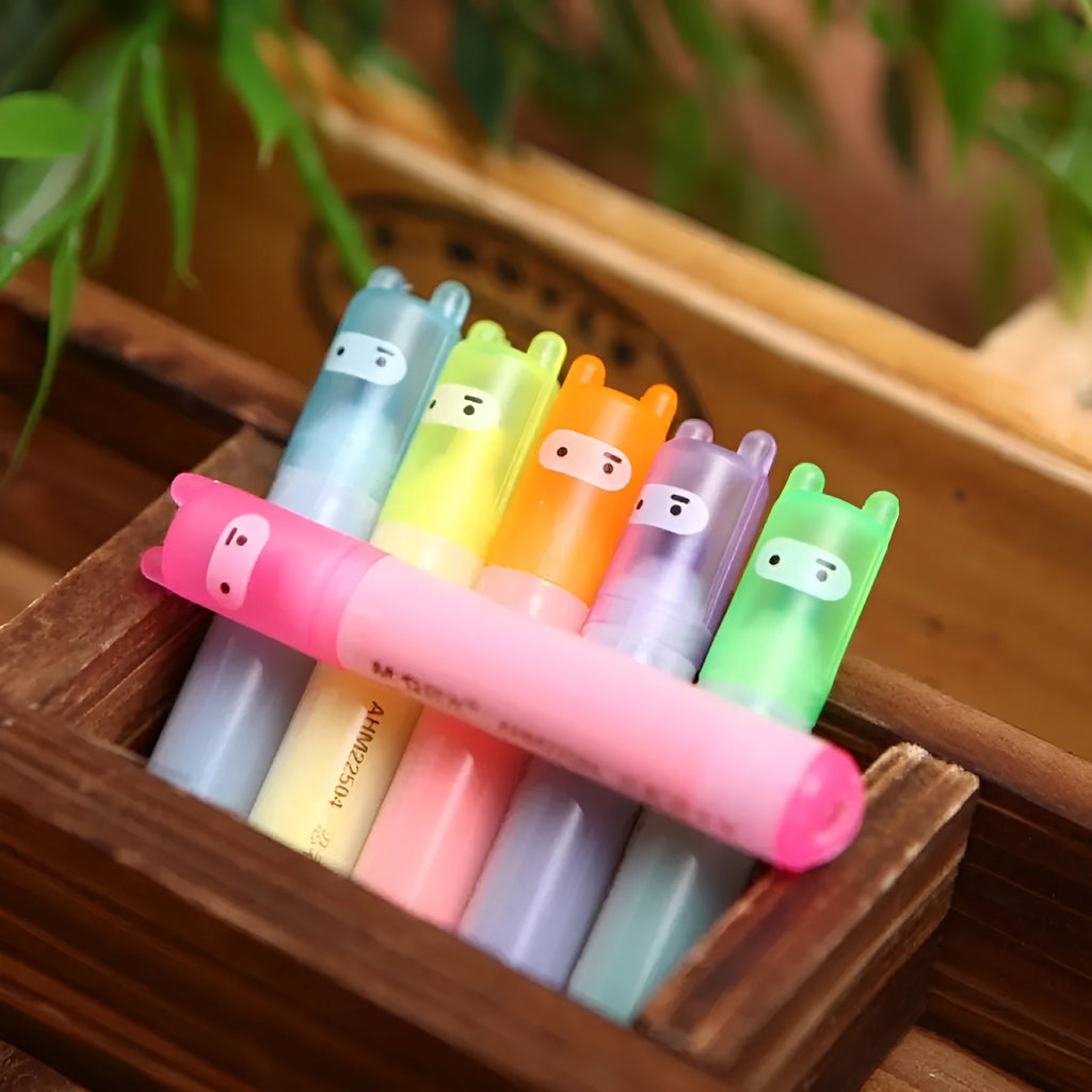 Six plastic highlighter pens with oblique shape and chisel tips in multiple colours for text marking