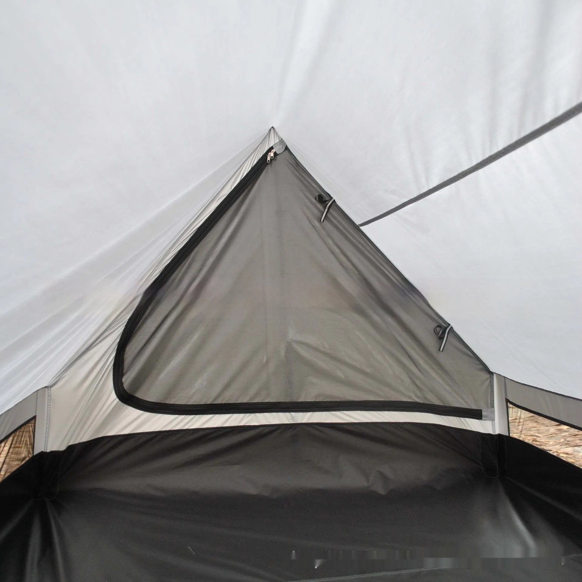 Brown or white A-line pole-free cabin tent for 2-3 people with hiking cane setup.