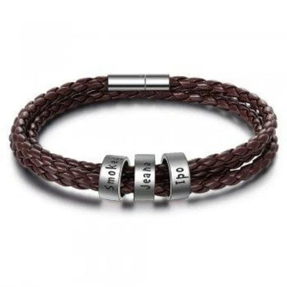 Personalized leather bracelet with engraved name charm for men, featuring a braided design and stainless steel beads