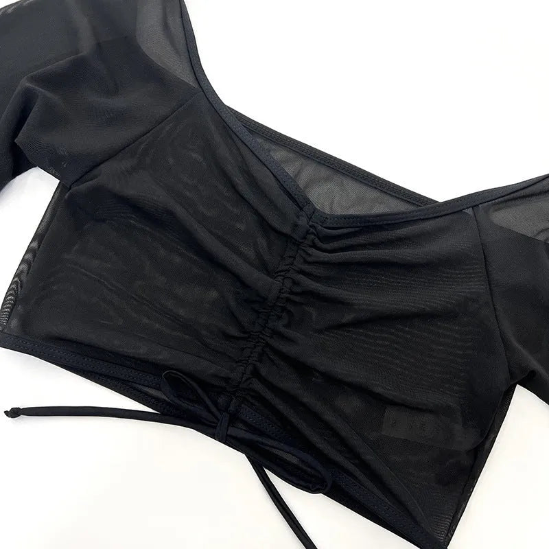 Black long sleeve mesh bikini swimsuit set for women, four pieces.