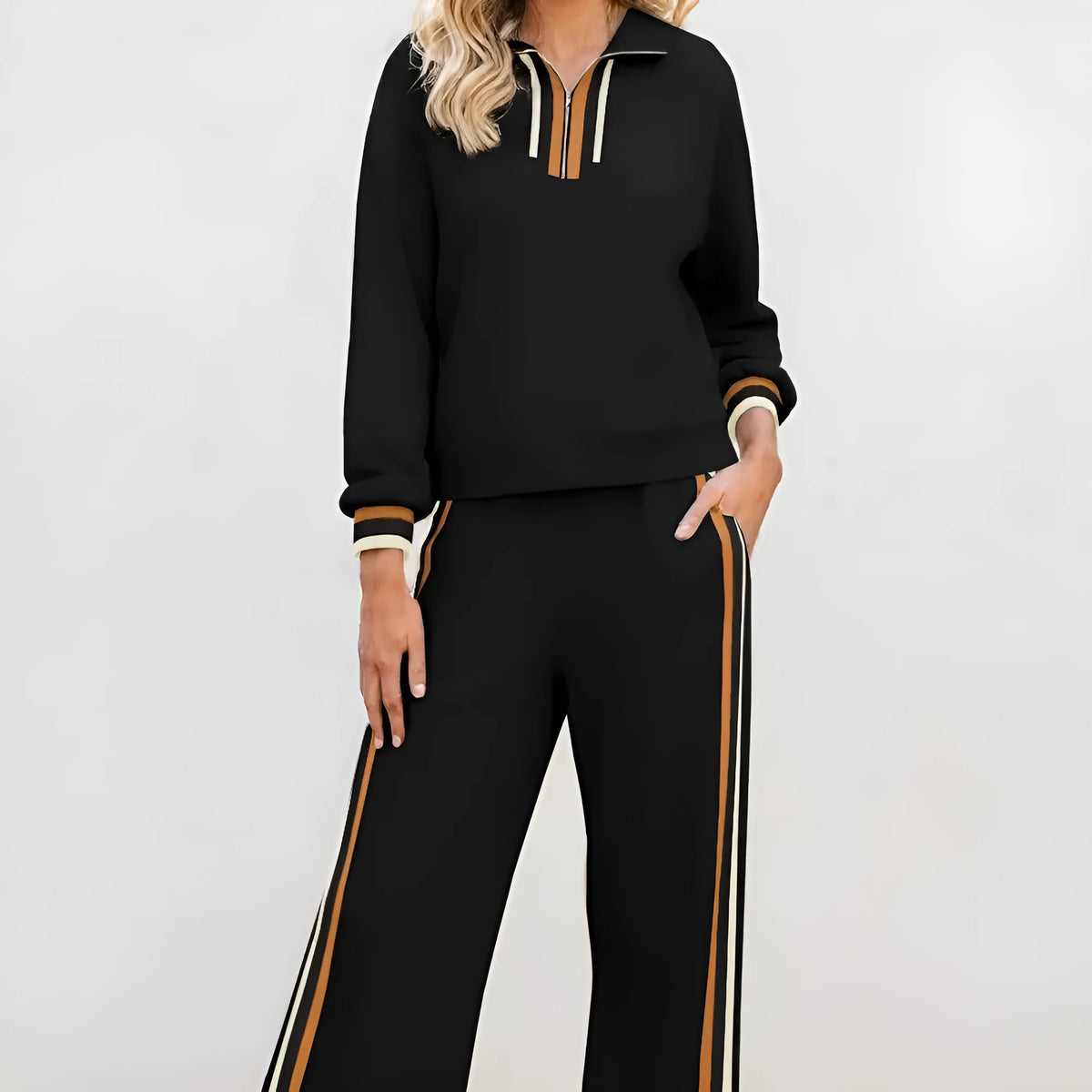 Black striped patchwork quarter zip pullover and loose pant set for women, two-piece outfit in polyester viscose elastane blend.