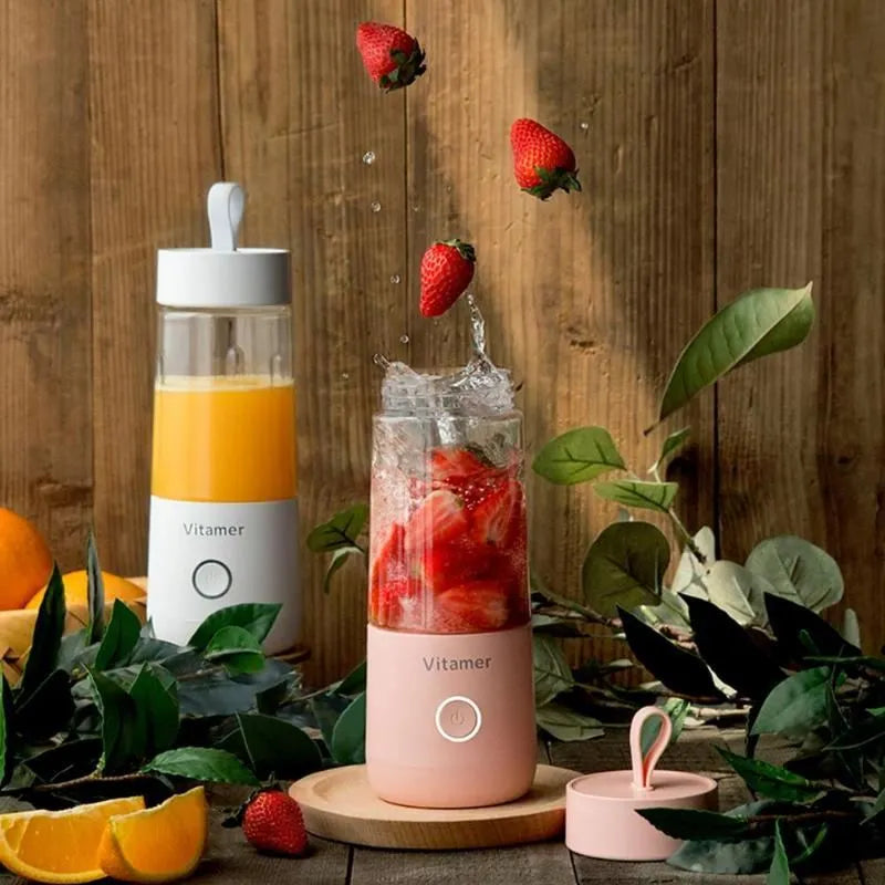 White portable USB blender bottle with silicone handle and stainless steel blade inside.