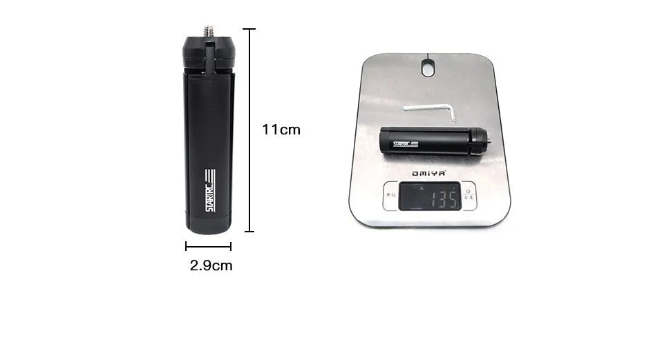 Silver aluminium smartphone bracket for tripod mounting next to a mobile phone.