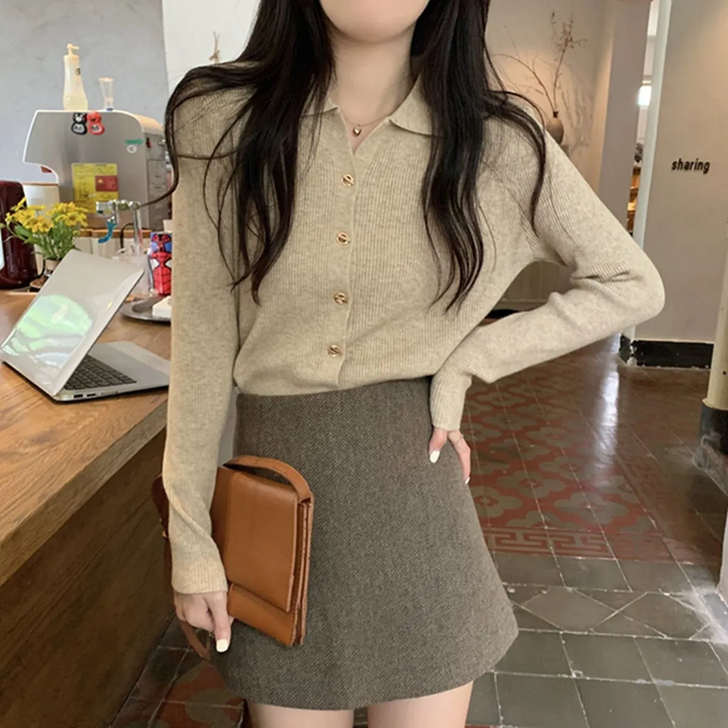 Women's beige knitted cardigan top with long sleeves and loose fit design