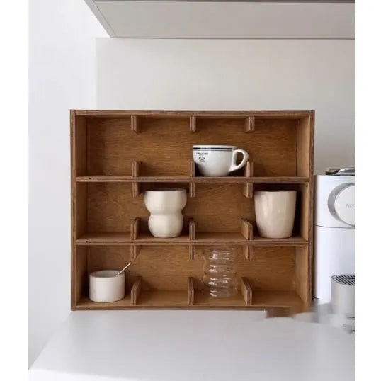 Square solid wood cup storage rack with multiple grids in natural birch wood colour.