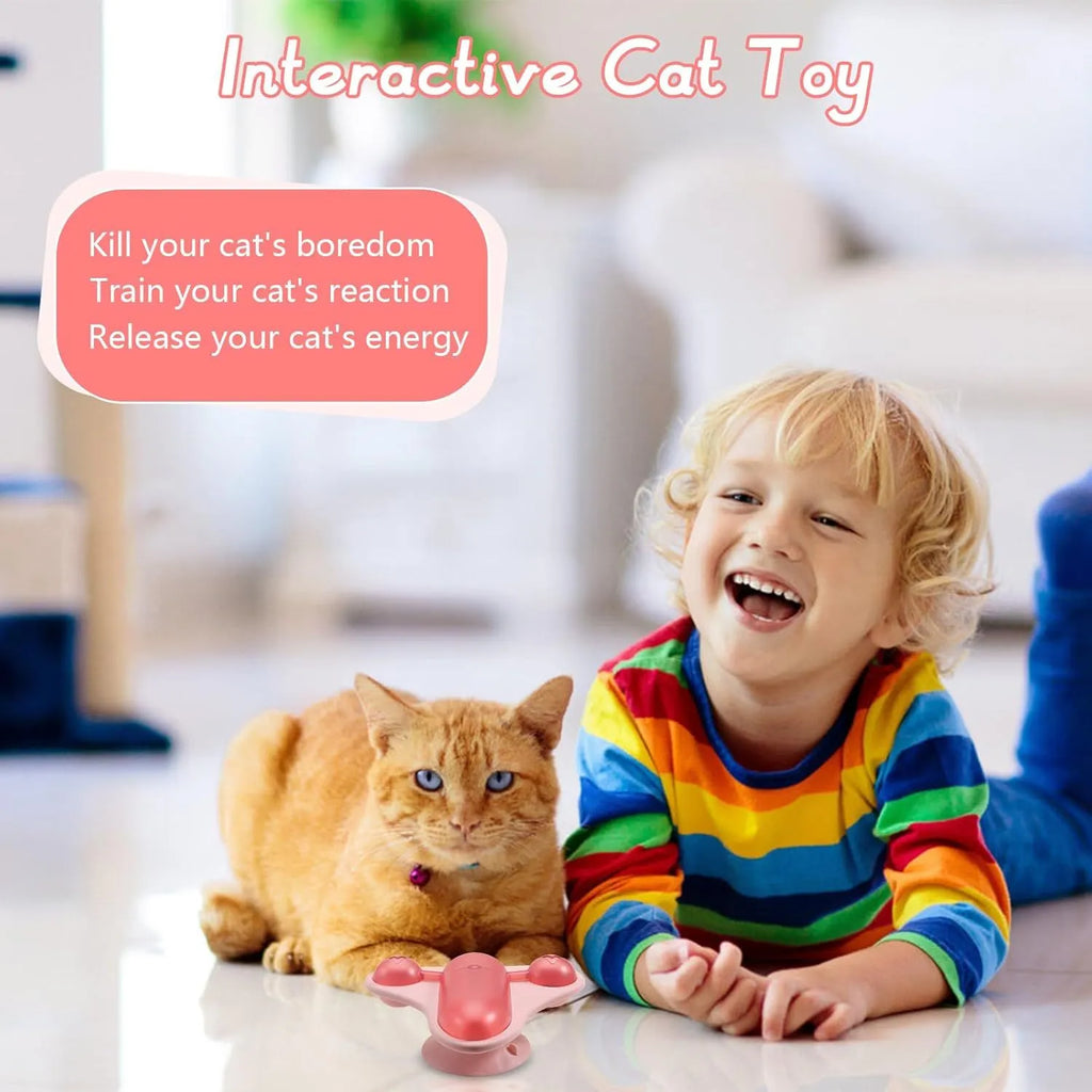 Blue interactive pet puzzle feeder toy with snack cabin, bell, and catnip on a suction cup base.