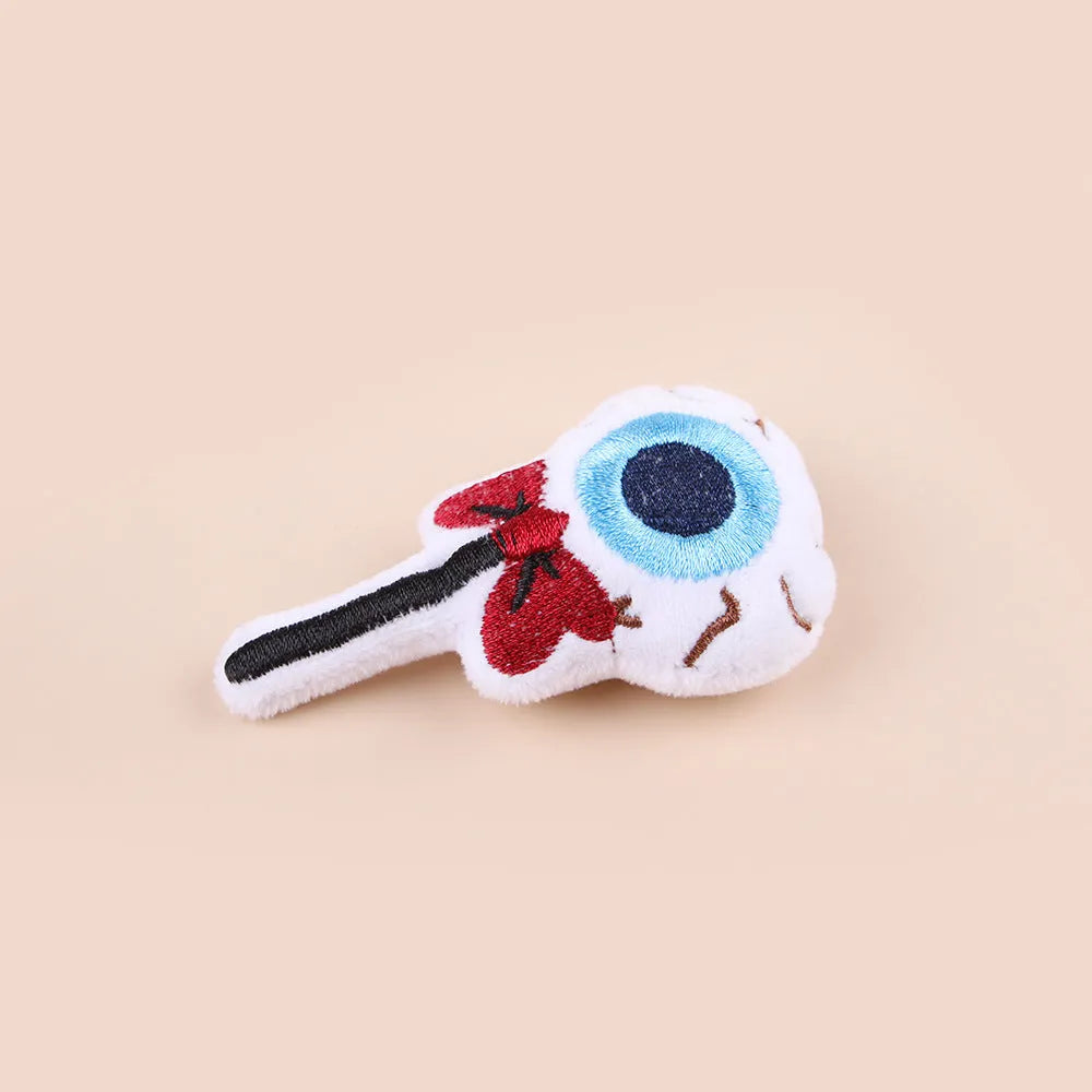 Plush cat teaser wand with candy-shaped attachment for interactive play