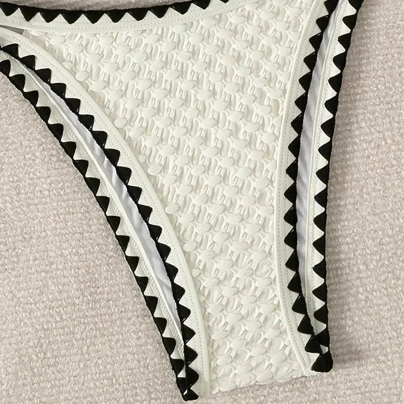 Women's two-piece split bikini swimsuit in white and blue colours with brief-style cut