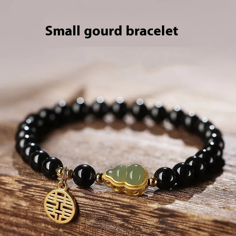 Black obsidian bracelet with Hetian jade gourd charm in geometric pattern