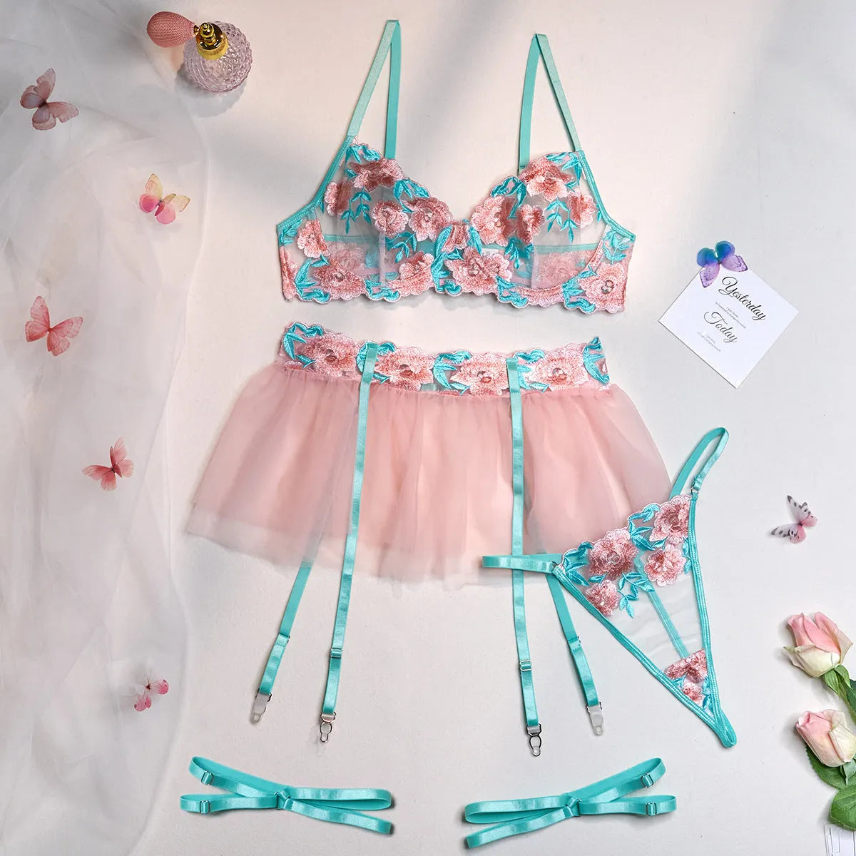 Pink women's embroidered mesh pettiskirt lingerie suit with matching bikini.