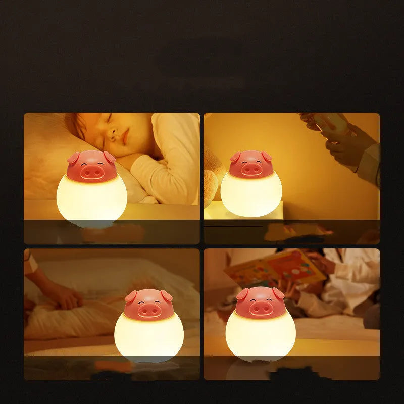 Pink pig silicone pat bedside lamp with USB LED light source on a table