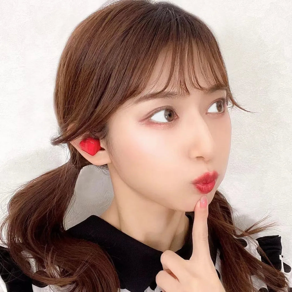 Heart-shaped wireless Bluetooth headphones in red or pink colours with earplug design