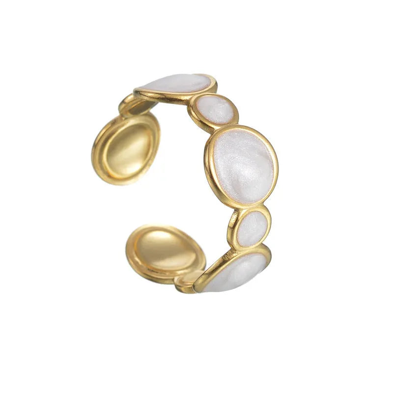 Adjustable stainless steel geometric ring with electroplated finish shown on hand