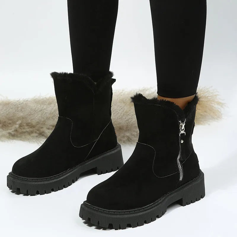 Women's black high-top snow boot with side zip, faux fur lining visible, and a rubber sole.