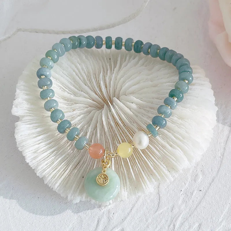 Natural blue water Hetian jade bracelet with carved gourd charm and engraved peace buckle