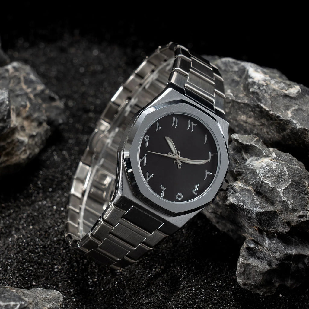 Men's business casual watch with stainless steel band and black dial on wrist
