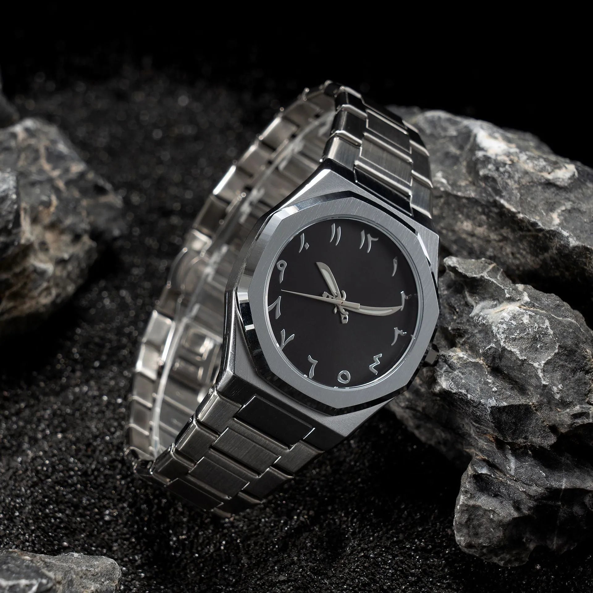Men's business casual watch with stainless steel band and black dial on wrist