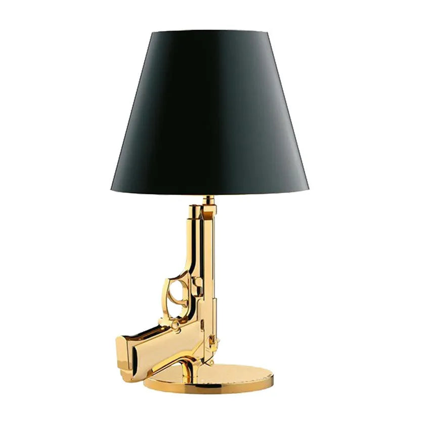 Nordic style creative desk lamp with plated gold resin base on a wooden desk