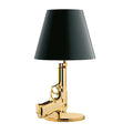 Nordic style creative desk lamp with plated gold resin base on a wooden desk