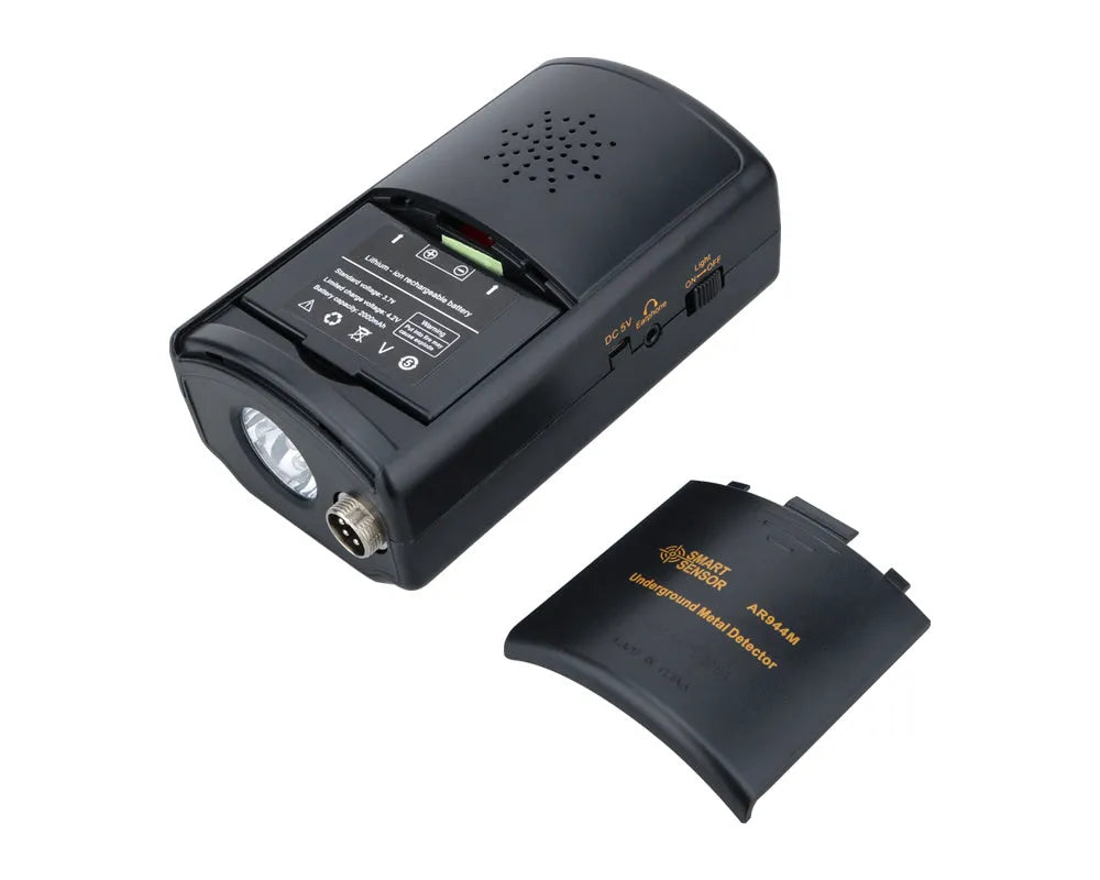 AR944M underground metal detector in black with search coil, adjustable shaft, and control box on grass