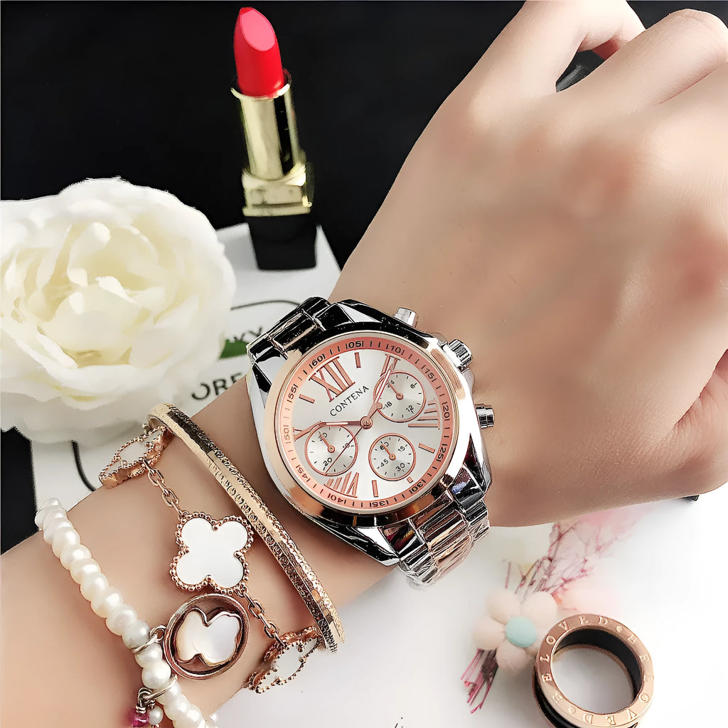 Women's silver rose gold fashion watch with mesh strap and pointer display.