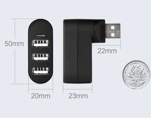 Black and white USB hub with a spinning multi-interface design on a desk.