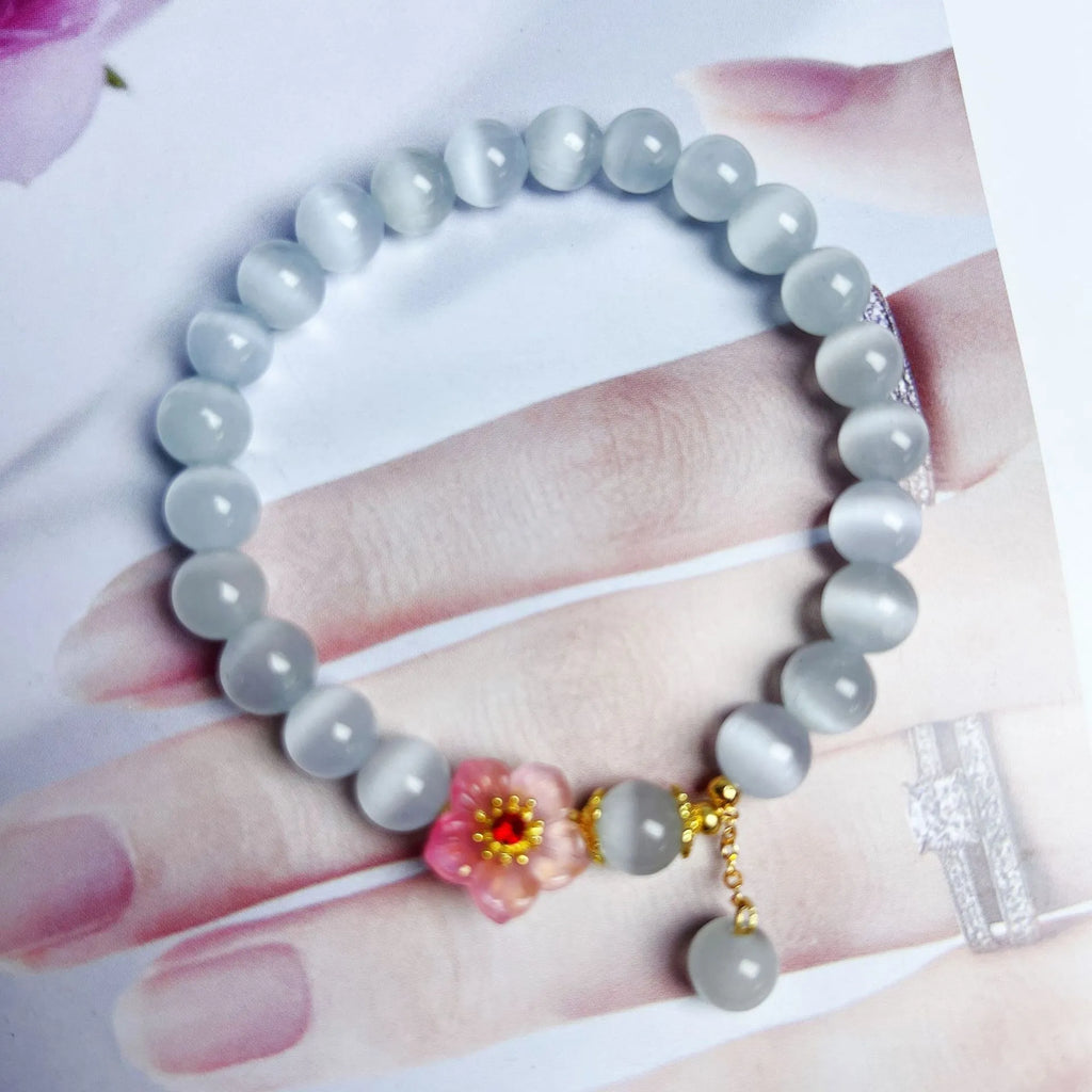White opal flower beaded bracelet with Chinese style design using glass and coloured glaze materials