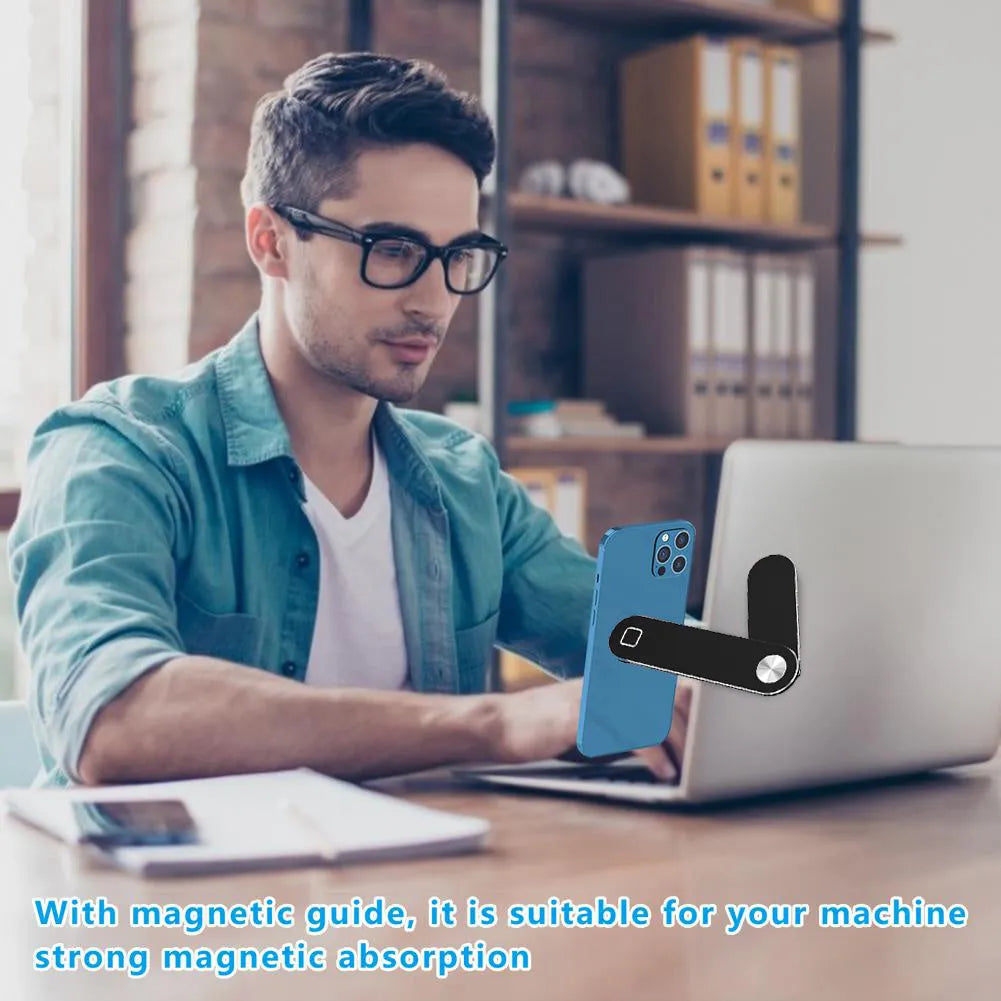 Black magnetic laptop phone holder clip attached to a monitor with a smartphone mounted.