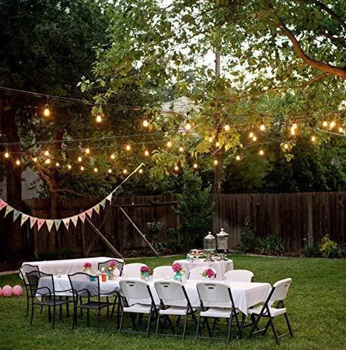 Waterproof solar-powered LED string lights with PVC bulbs in an outdoor garden setting.