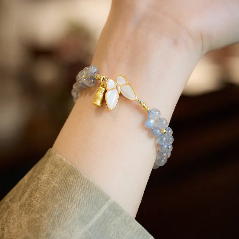 Grey moonstone woven bracelet with butterfly knots and geometric retro design