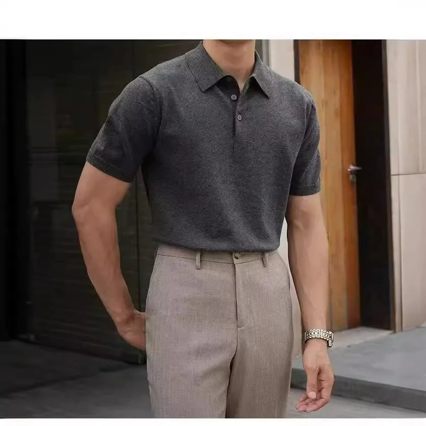 Knitted short-sleeve polo shirt in ice silk cotton fabric on a hanger, showing polo collar detail.