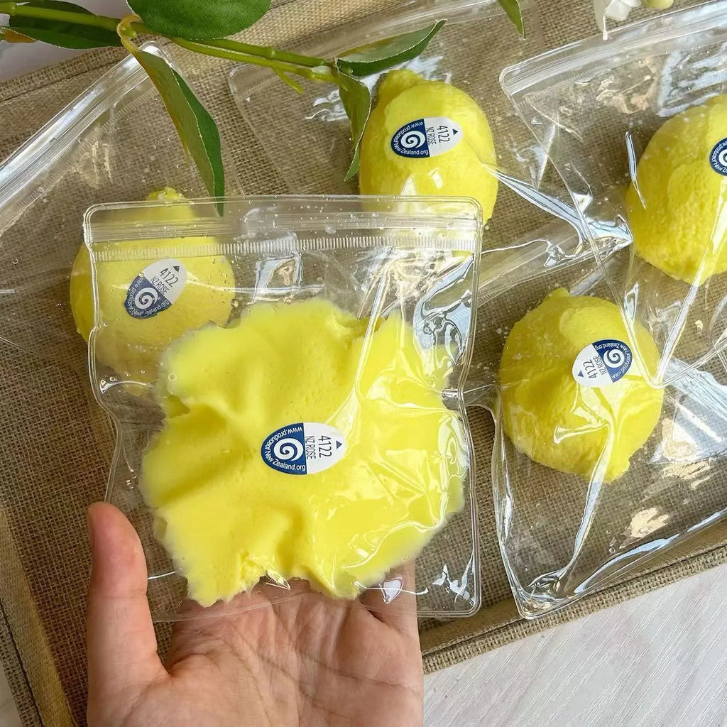 Bright yellow silicone lemon squeezing toy for stress relief and hand training