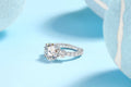 Three-diamond moissanite wedding ring with 5-carat stone, S925 silver band, platinum plating, on a white background