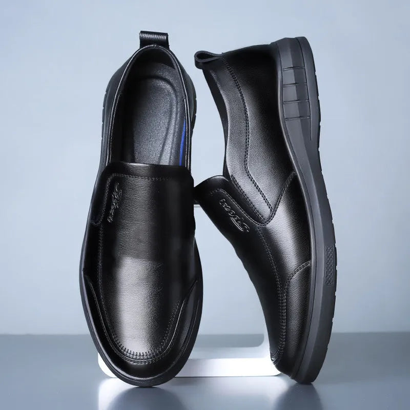 Men's black casual leather shoes with non-slip soft sole and round toe on a white background