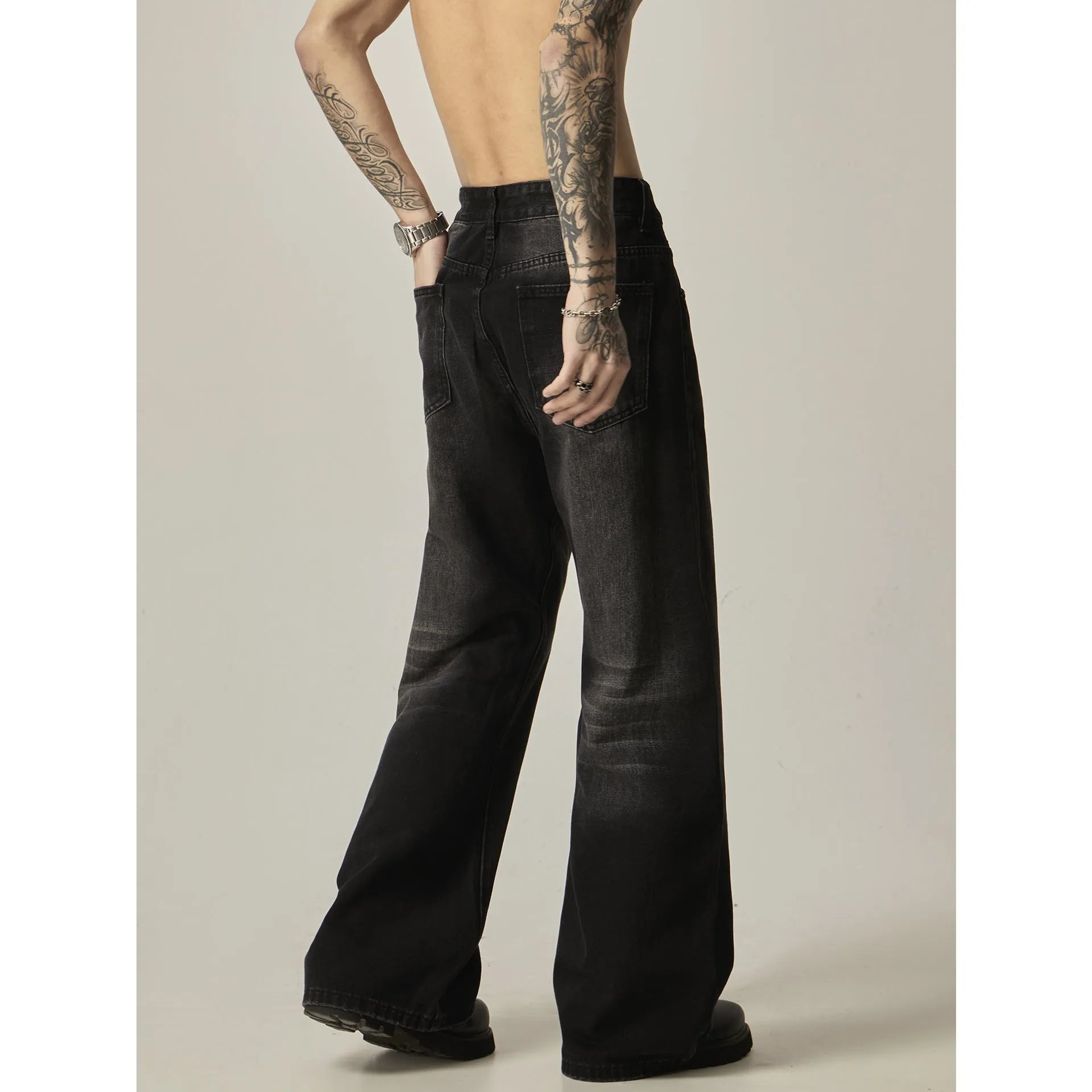 Black loose straight retro jeans with zipper fly shown from front and back views