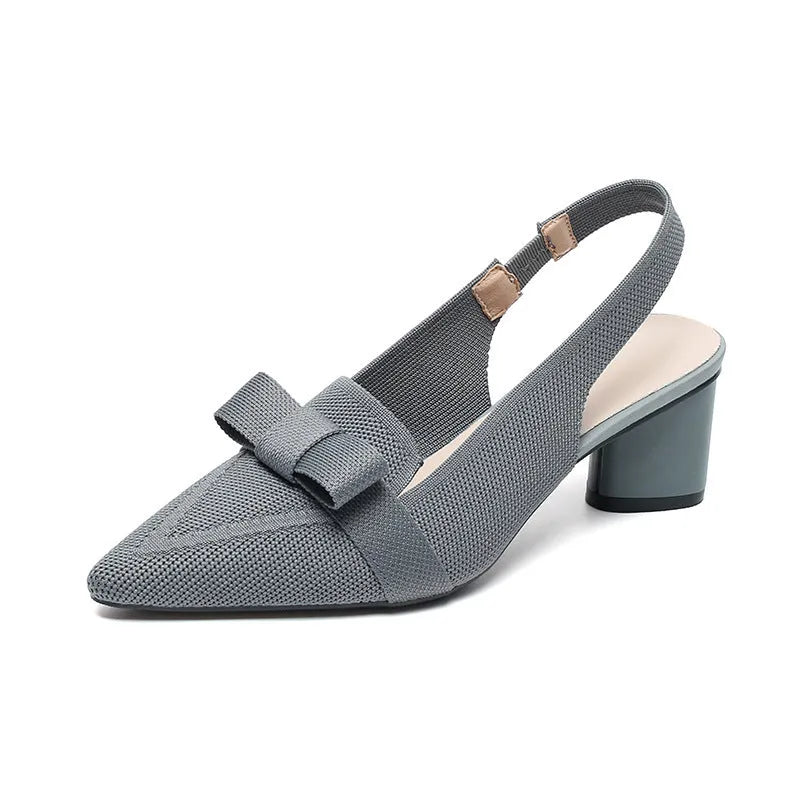 Women's black high heel sandals with closed pointed toe, decorative bow, and ankle buckle strap.