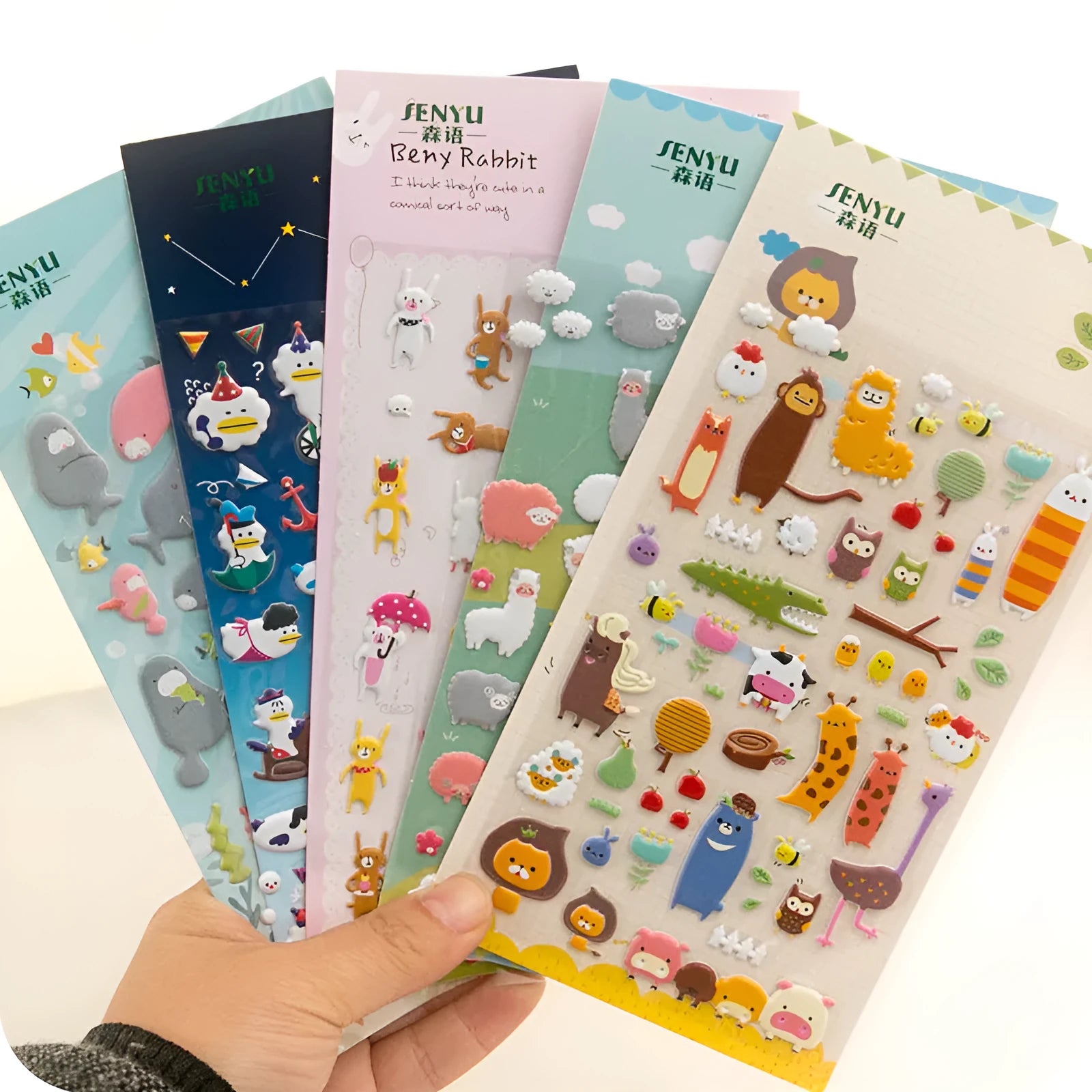 Cartoon 3D bubble stickers showing raised alpaca, dinosaur, cat and smiley face designs for hand account decoration