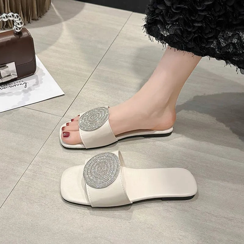 Open toe PU slippers with rhinestone trim in black colour