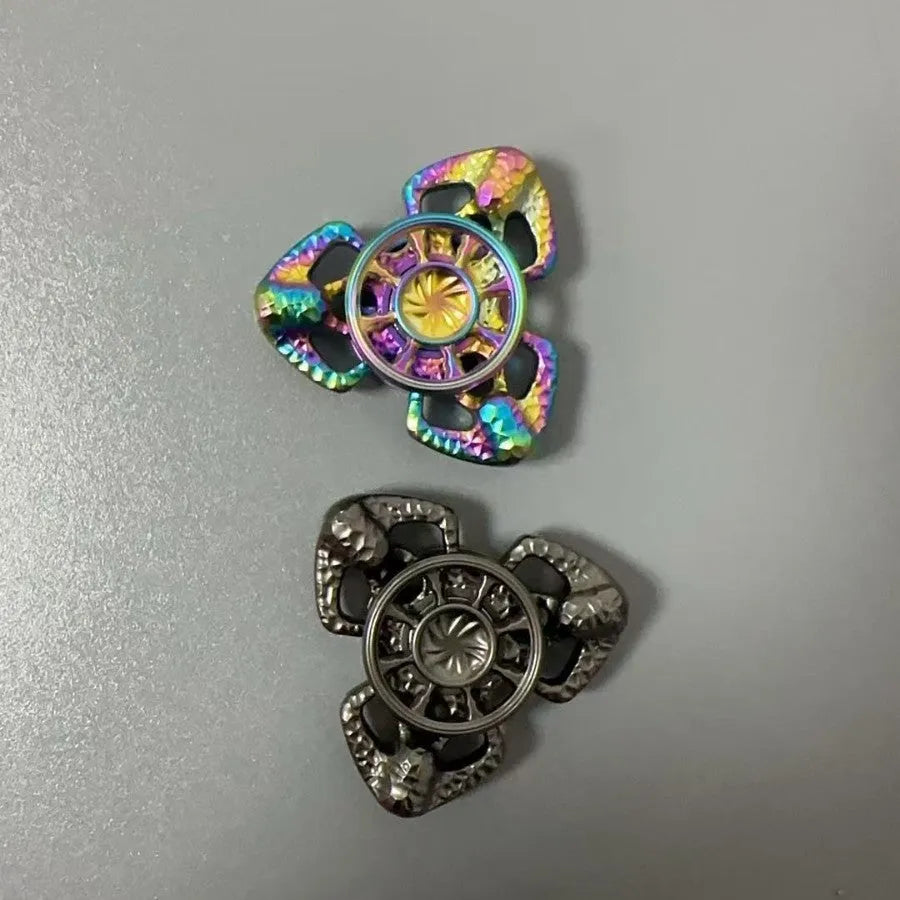 Flame Butterfly alloy metal rotating fingertip fidget gyro toy in colourful or space grey.