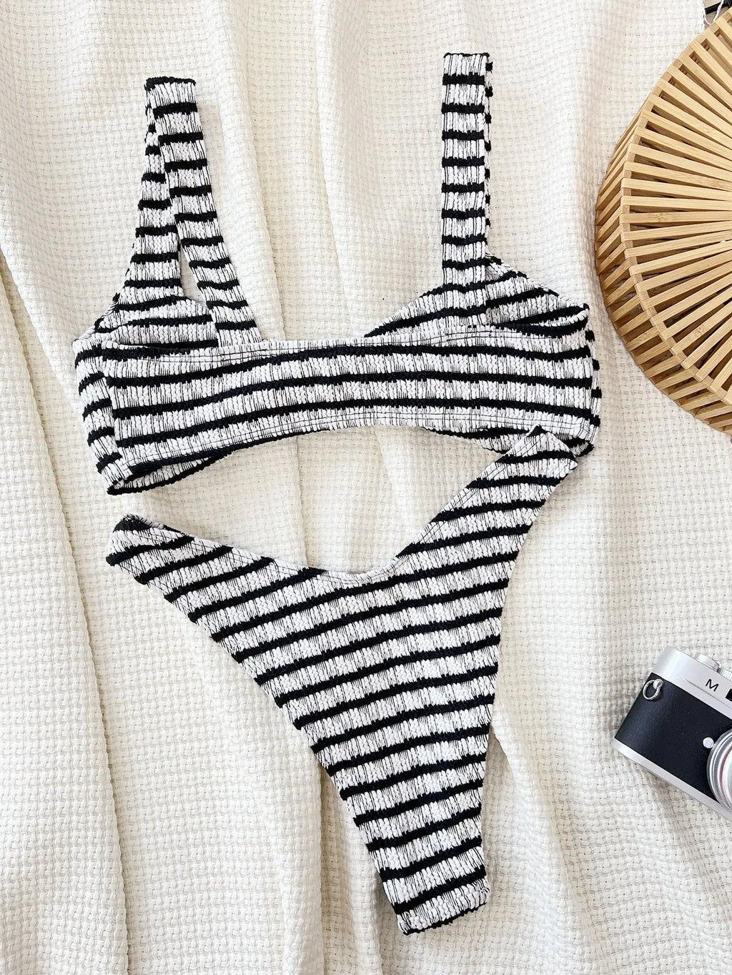 Women's black and white contrast colour bikini set with polyester fabric, slim brief cut, and bra and shorts