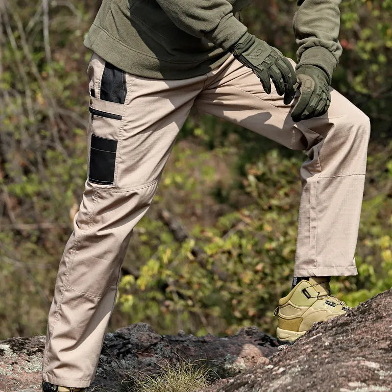 Multi-pocket water repellent outdoor pants in polyester cotton blend, available in five colours, sizes S to XXXL