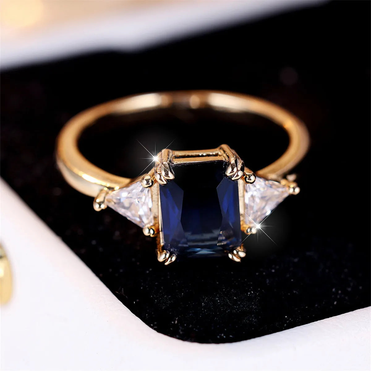 Rectangular copper ring with gold sapphire blue finish for women, shown in size options 6 to 13