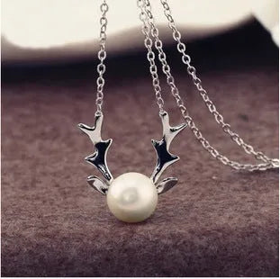 Small elk pearl pendant in copper with gold finish, front view against white background