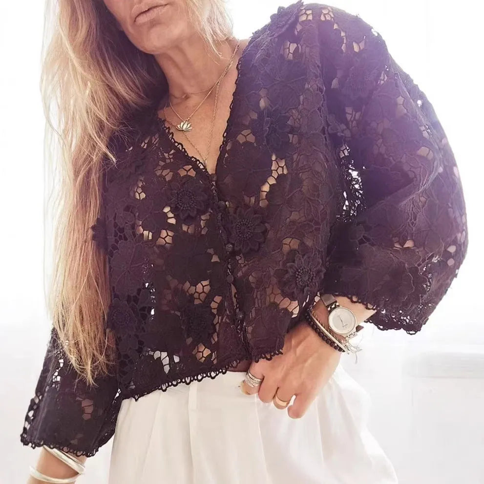 Loose fit black lace cardigan with V-neck, hollow long sleeves, and raised three-dimensional floral lace decoration.