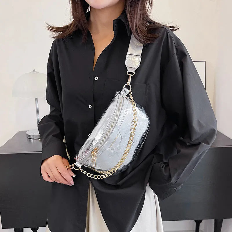Shiny chest bag with WesternWide shoulder strap, chain detail, and hard PU shell in black colour