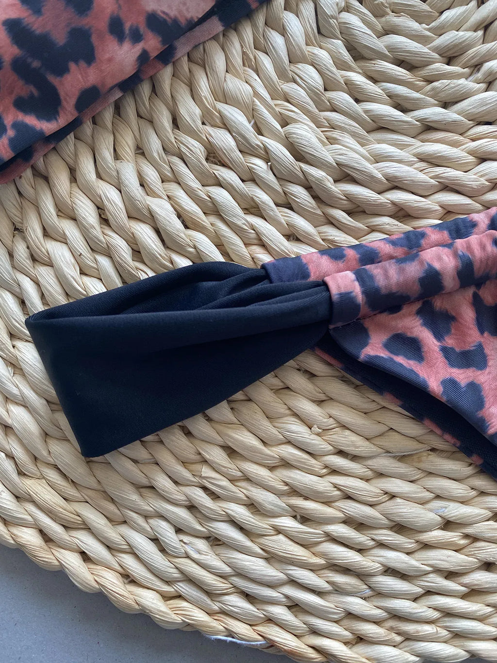 Women's leopard print tube top bikini set with matching T-pants on a mannequin.