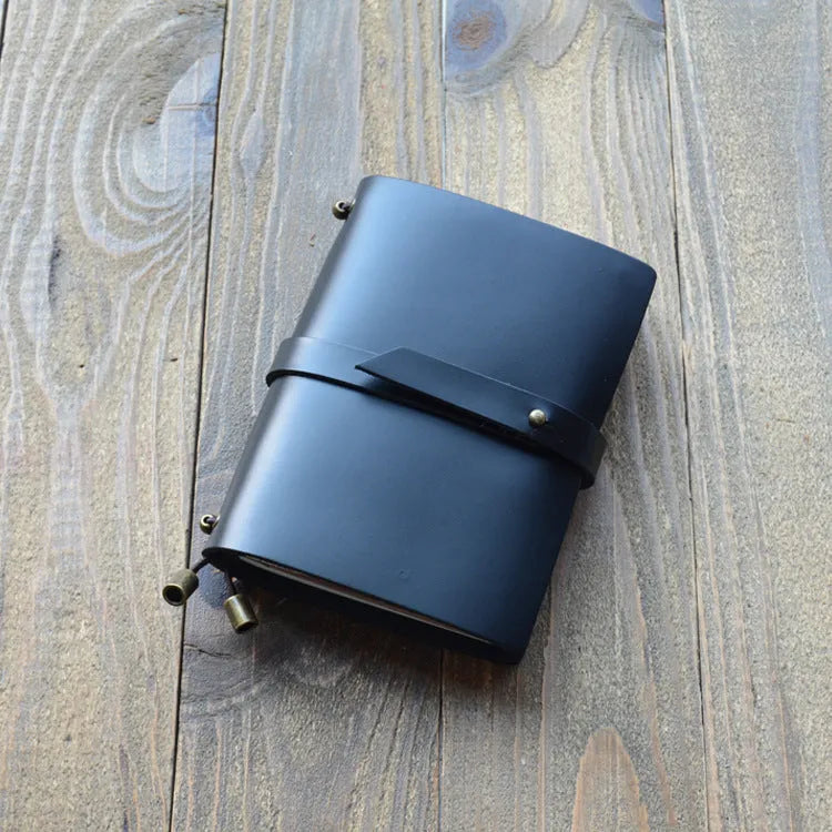 Carved cowhide leather passport holder showing decorative patterns in available colour options