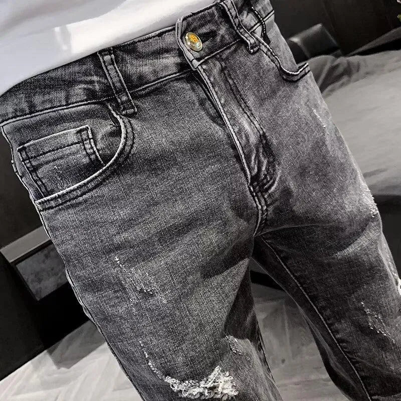 Men's high waist blue jeans with a five-pocket design and button fly on a mannequin.